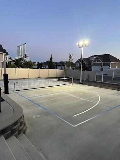 A finished concrete sport court poured on a graded base