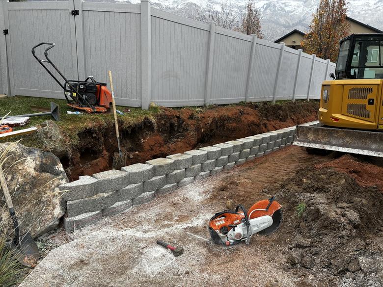Block being stacked in the trench as the wall goes up