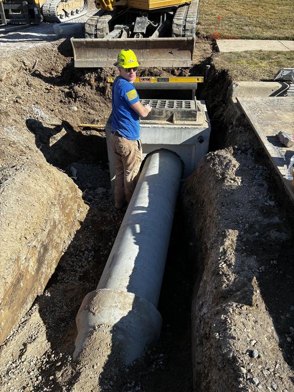 Pipe tied into a catch basin to carry water off the lot